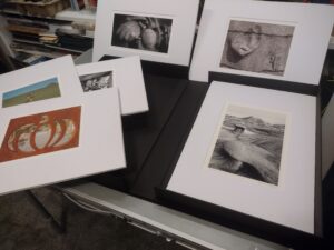Collection of matted and framed prints