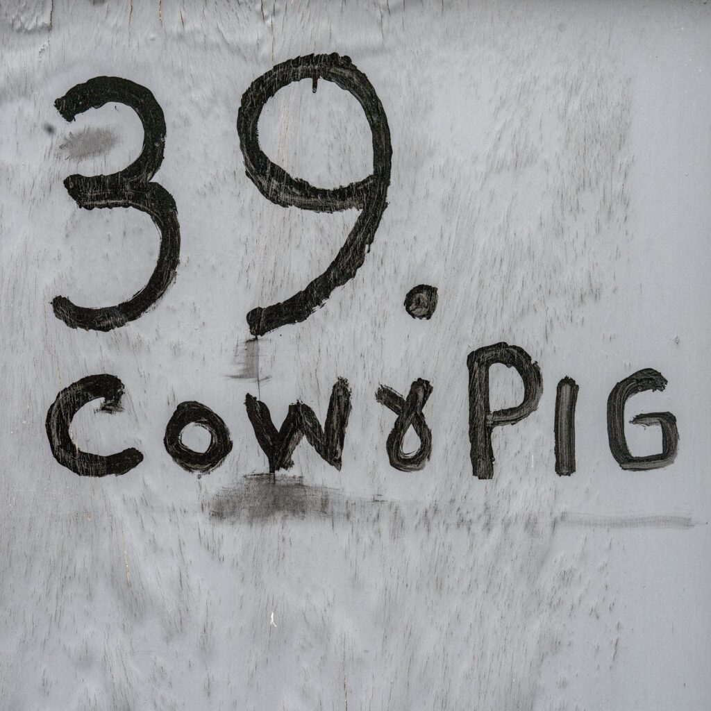 Cow and pig sign, Bromley North