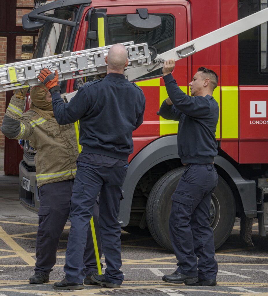 Loading ladder onto fire engine